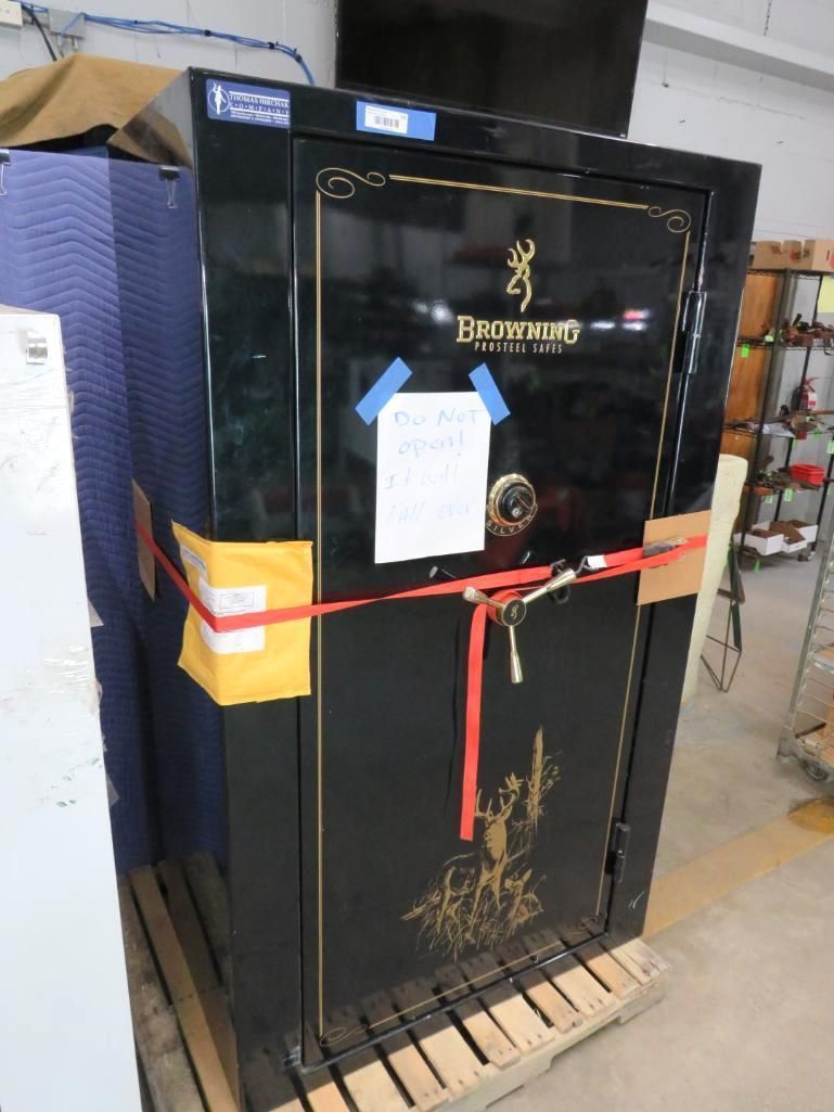 Large black Browning gun safe, strapped to a pallet.