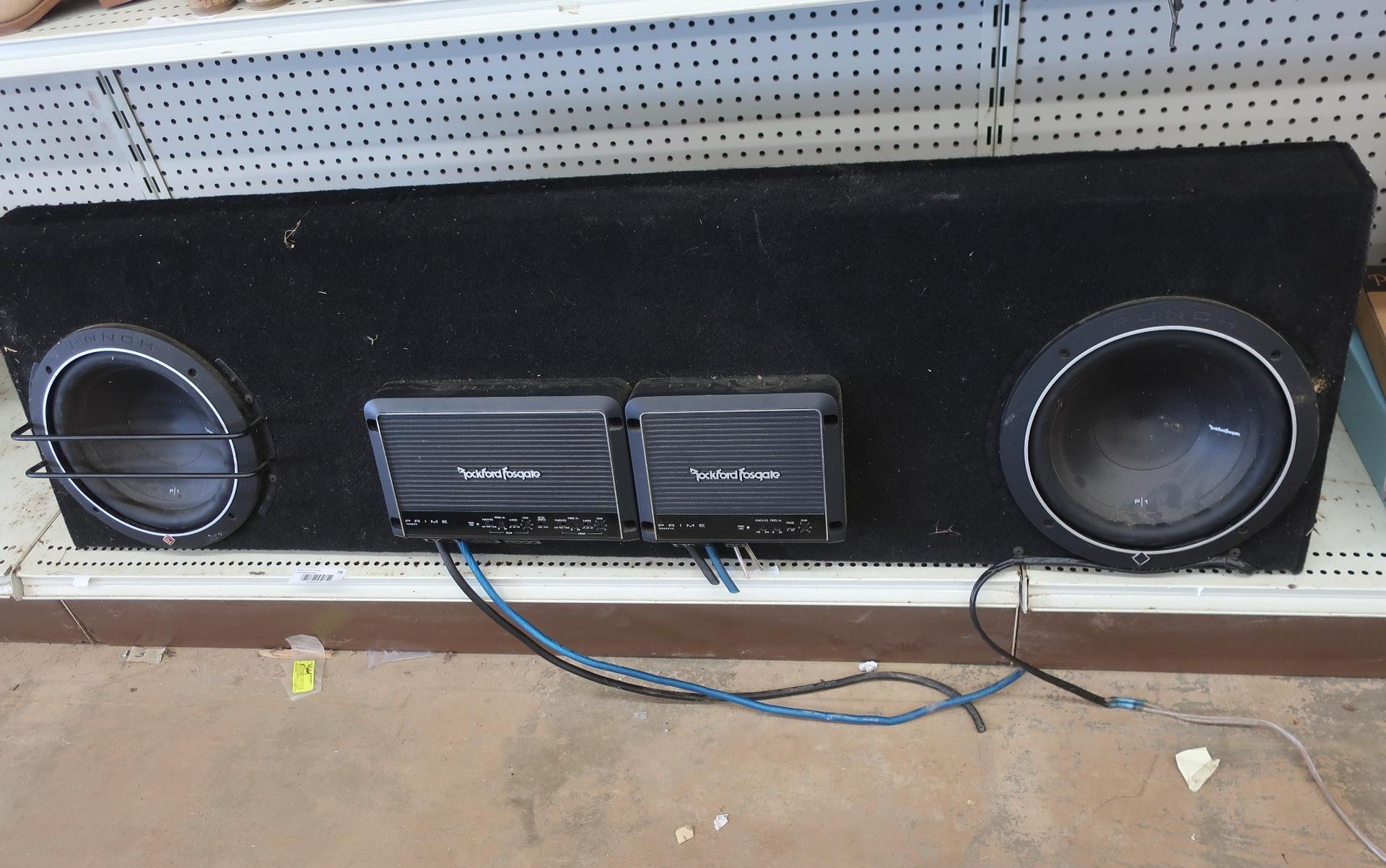 Black subwoofer enclosure with two speakers and two amplifiers.