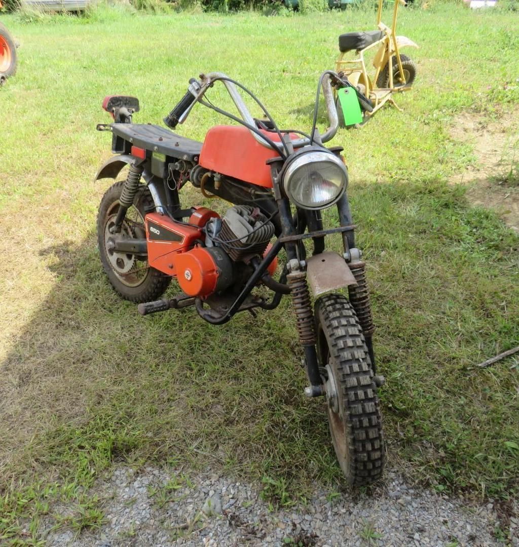 Vintage orange and black mini-bike.