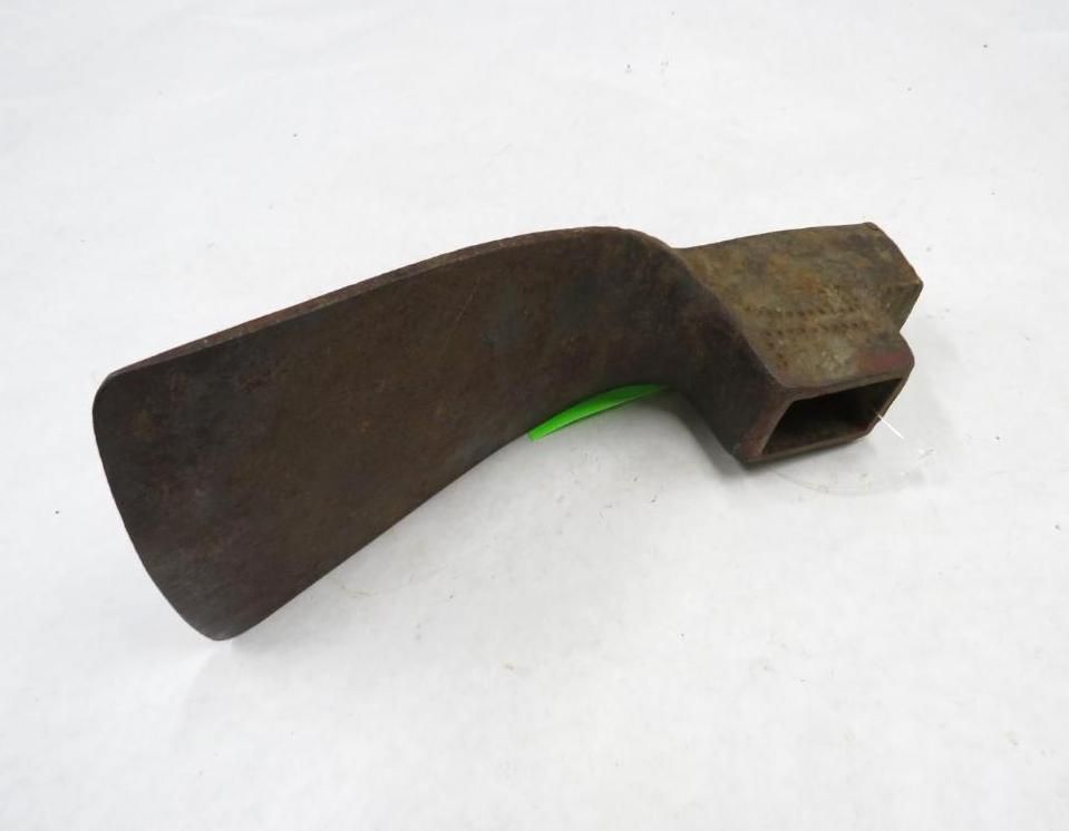 Metal weeding tool with a curved blade and rectangular socket.