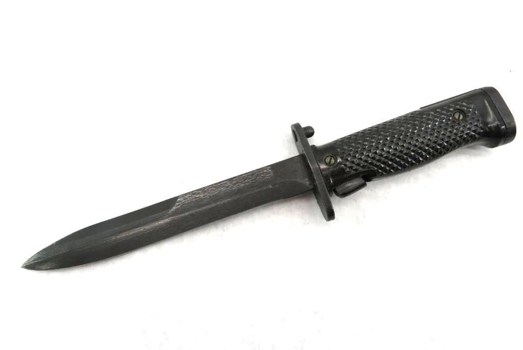 Black military bayonet knife on a white background.