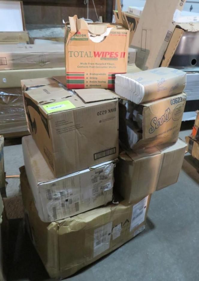 Stack of cardboard boxes, including cleaning wipes and paper towels.