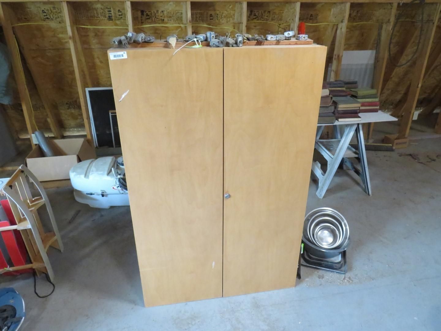 Light wood cabinet with two doors.