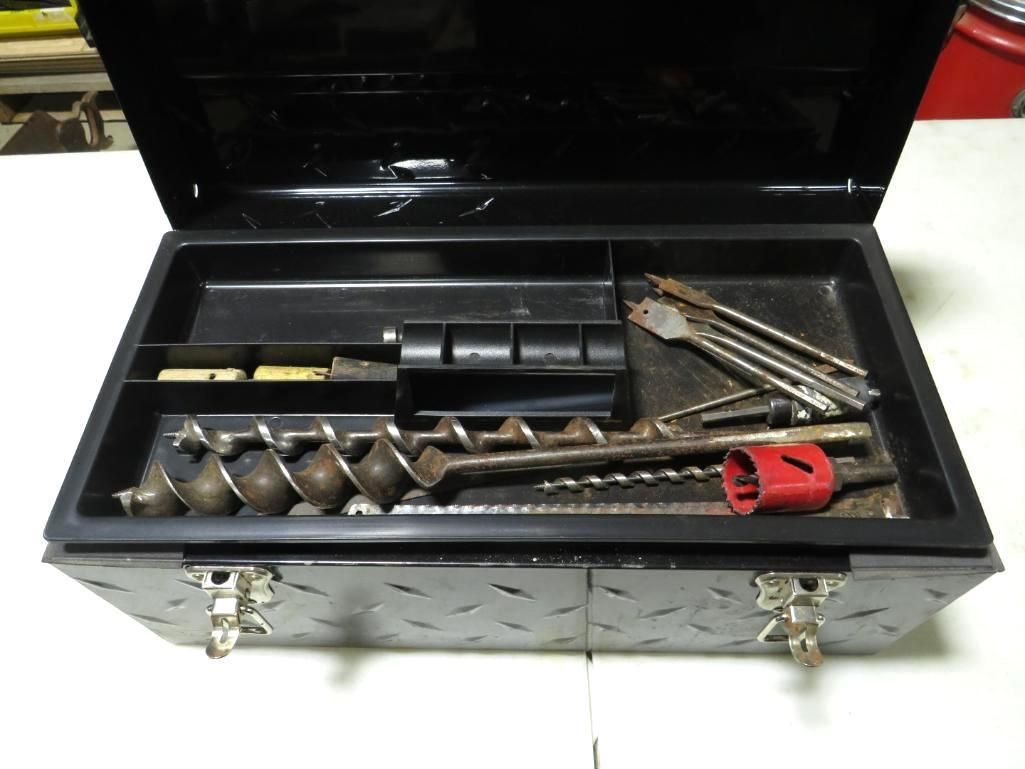 Black tool box open, with various drill bits and accessories.