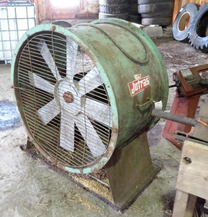 Large green fan, metal cage, and