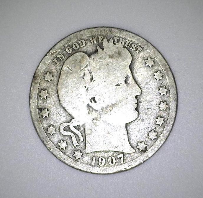 Silver 1907 Barber Quarter coin. Features a right-facing bust and 