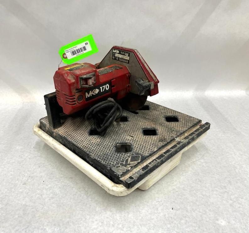 Red MK-170 tile saw on a white and black base, with a green tag.