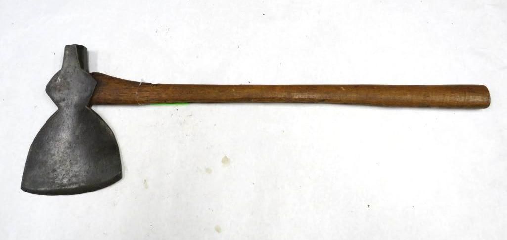 An axe with a metal head and a long wooden handle, lying on a white surface.