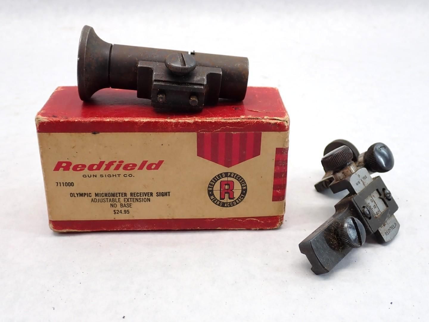 Two gun sights and a box, the box has