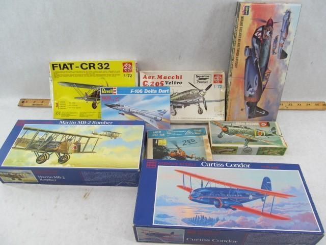 Assortment of vintage model airplane boxes with colorful artwork, including Fiat, Macchi, and Curtiss models.