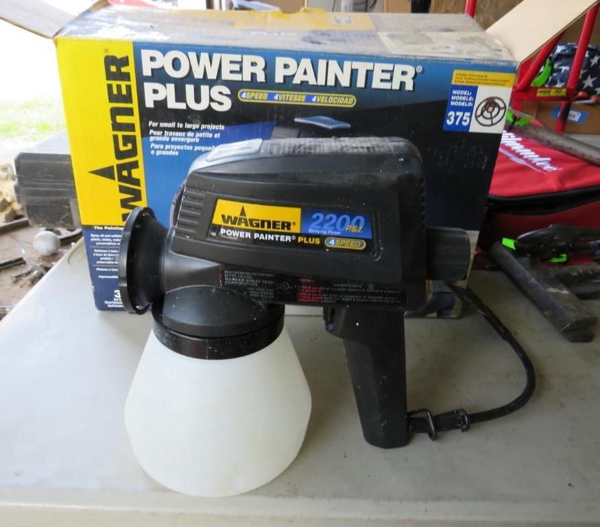 Wagner Power Painter Plus paint sprayer with original box on a table.