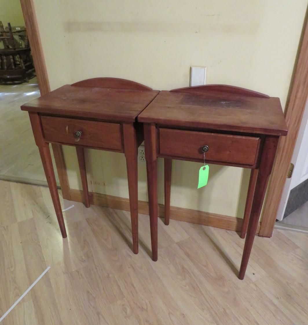 Two wooden nightstands with drawers, placed side-by-side, indoors.