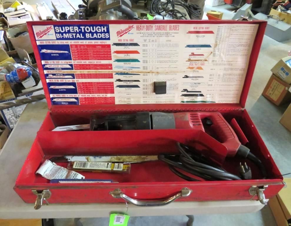Red Milwaukee Sawzall and blades in a red metal case.