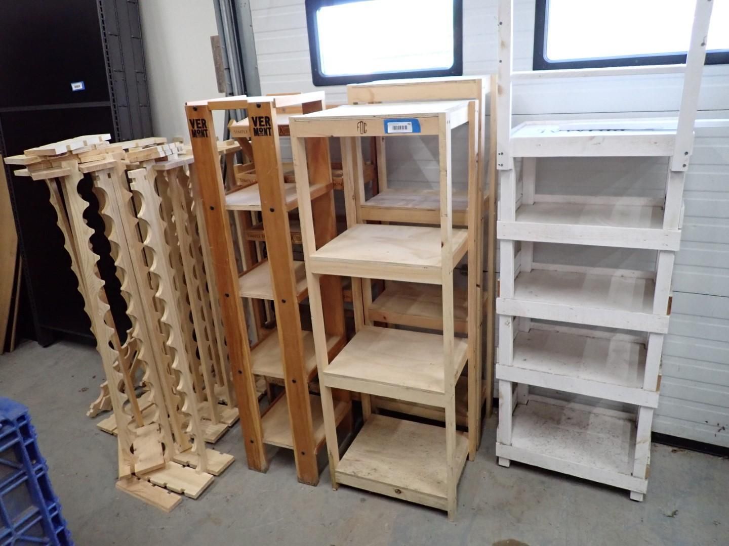 Wooden shelves and racks of varying heights and designs.
