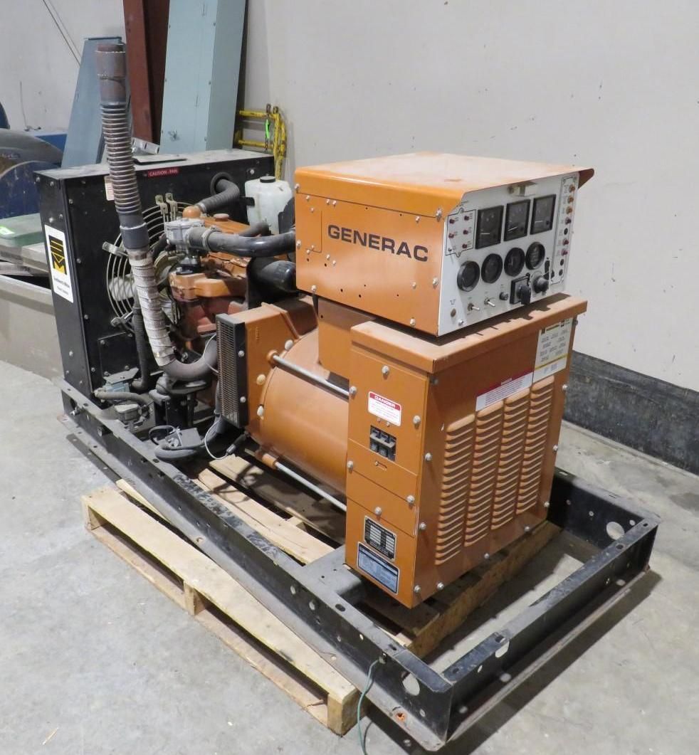 Generac industrial generator on a pallet, orange and black, indoors.