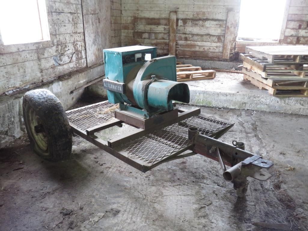 A teal generator on a trailer.