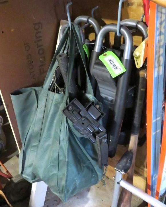 Green tote bag, dark accessories, and items with price tags hanging on hooks.