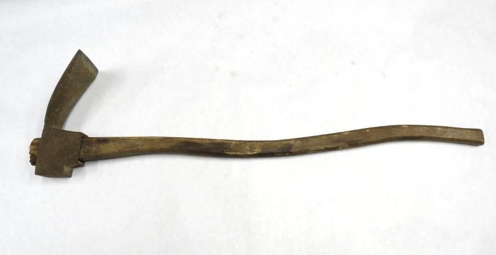 Hand tool with metal blade and wooden handle.