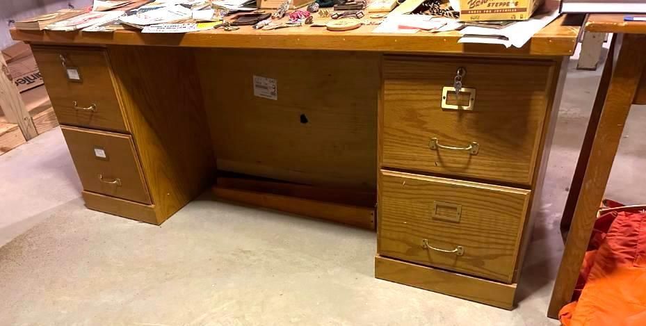 Wooden desk with two sets of drawers, lock on one side.