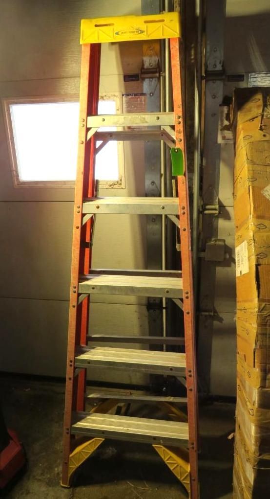 Orange and yellow fiberglass step ladder.
