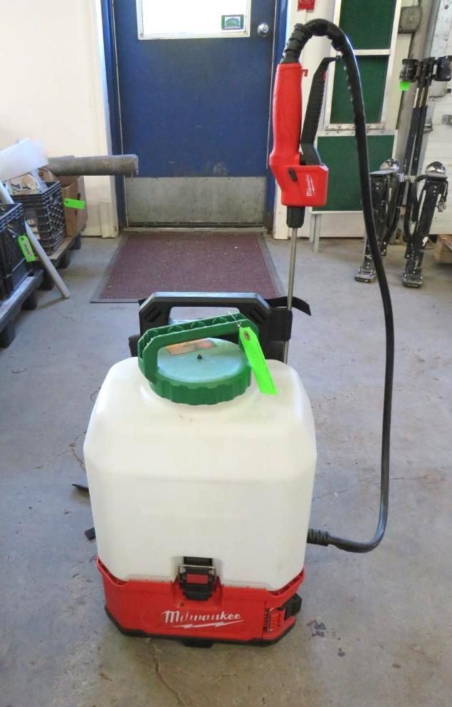 Milwaukee battery-powered backpack sprayer; white tank, red base and handle, black hose, green lid.