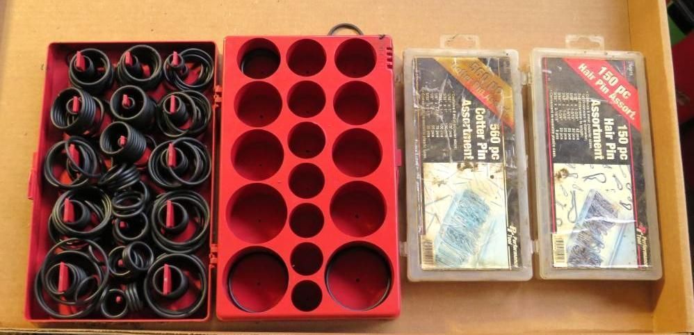 Toolbox with a variety of O-rings and small parts in a drawer. Black and red colors are visible.