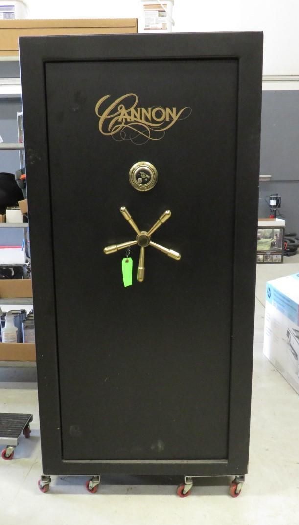 Black Casinor safe with gold logo and combination dial on rolling cart.