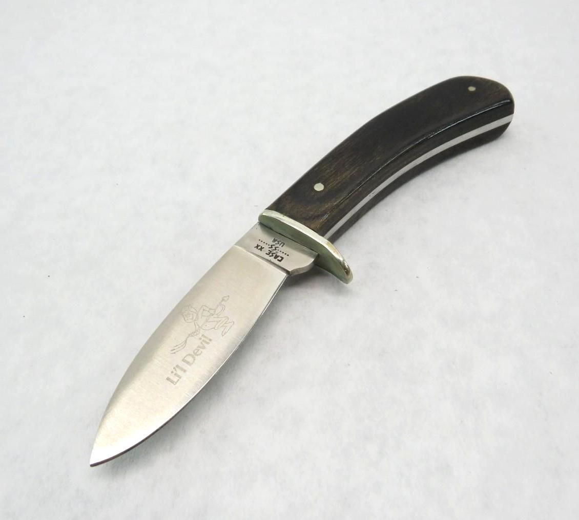 Hunting knife with dark wooden handle and silver blade.