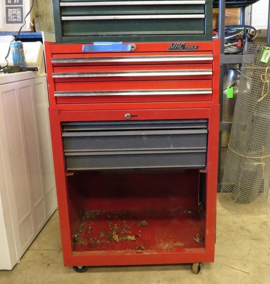 Red and black tool cabinet with drawers, some open.