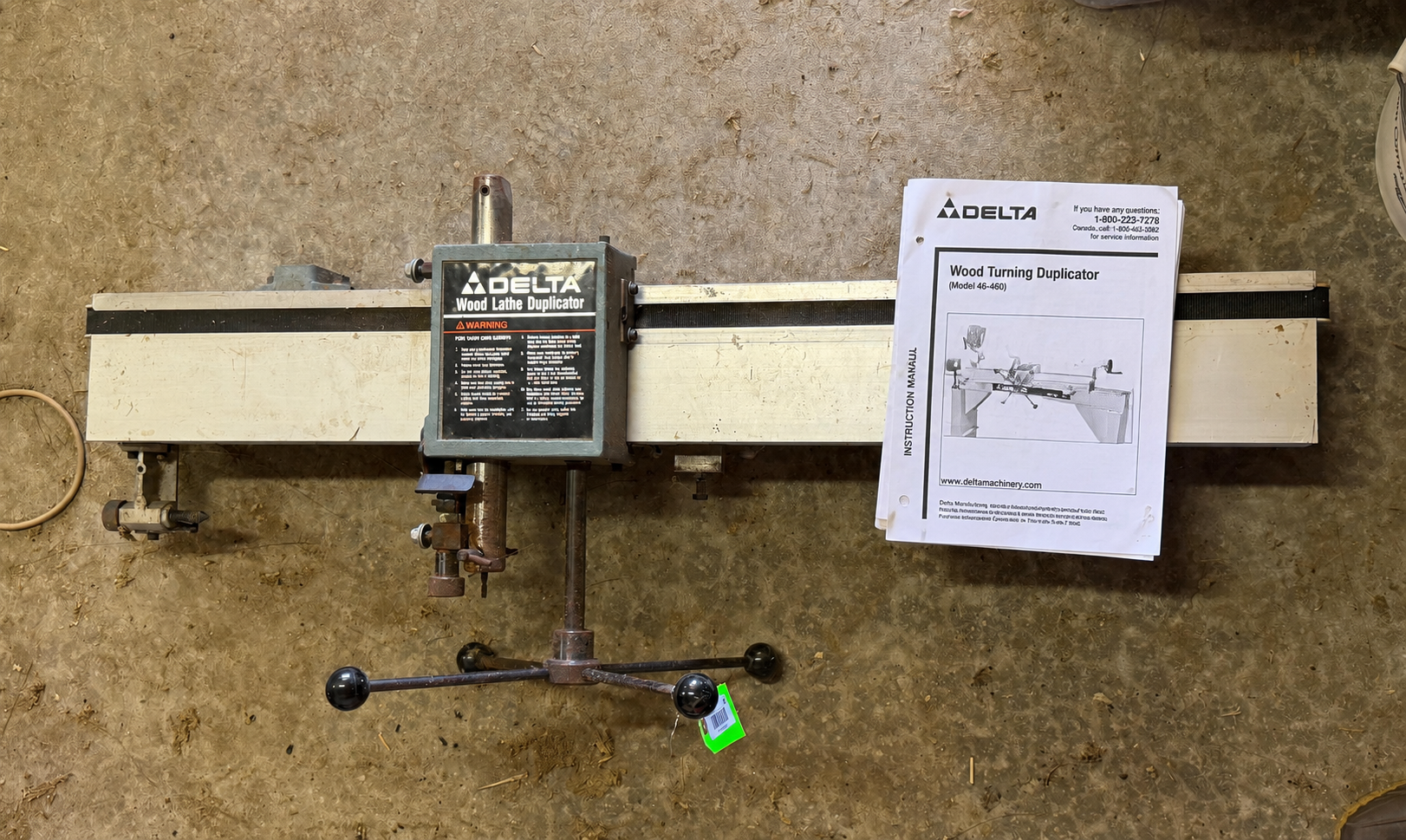 machine part and instruction sheet beside it