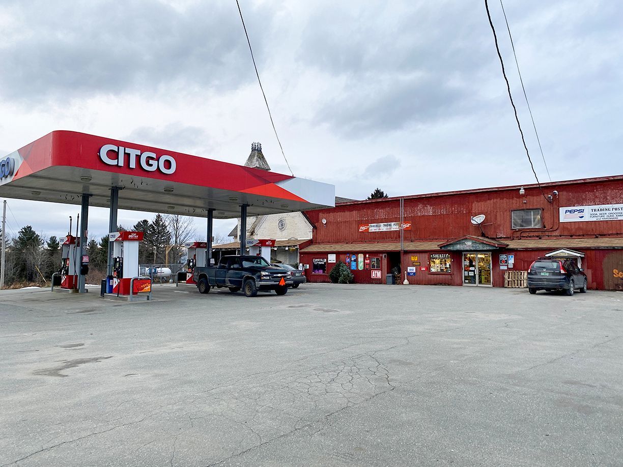 CITGO gas station with attached red-sided store.