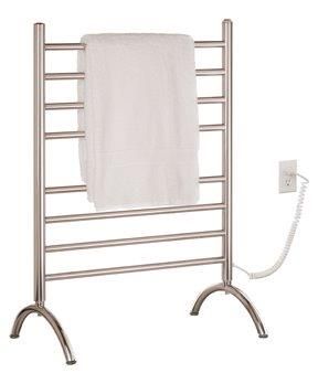 Heated stainless steel towel rack with a white towel, plugged into an outlet.