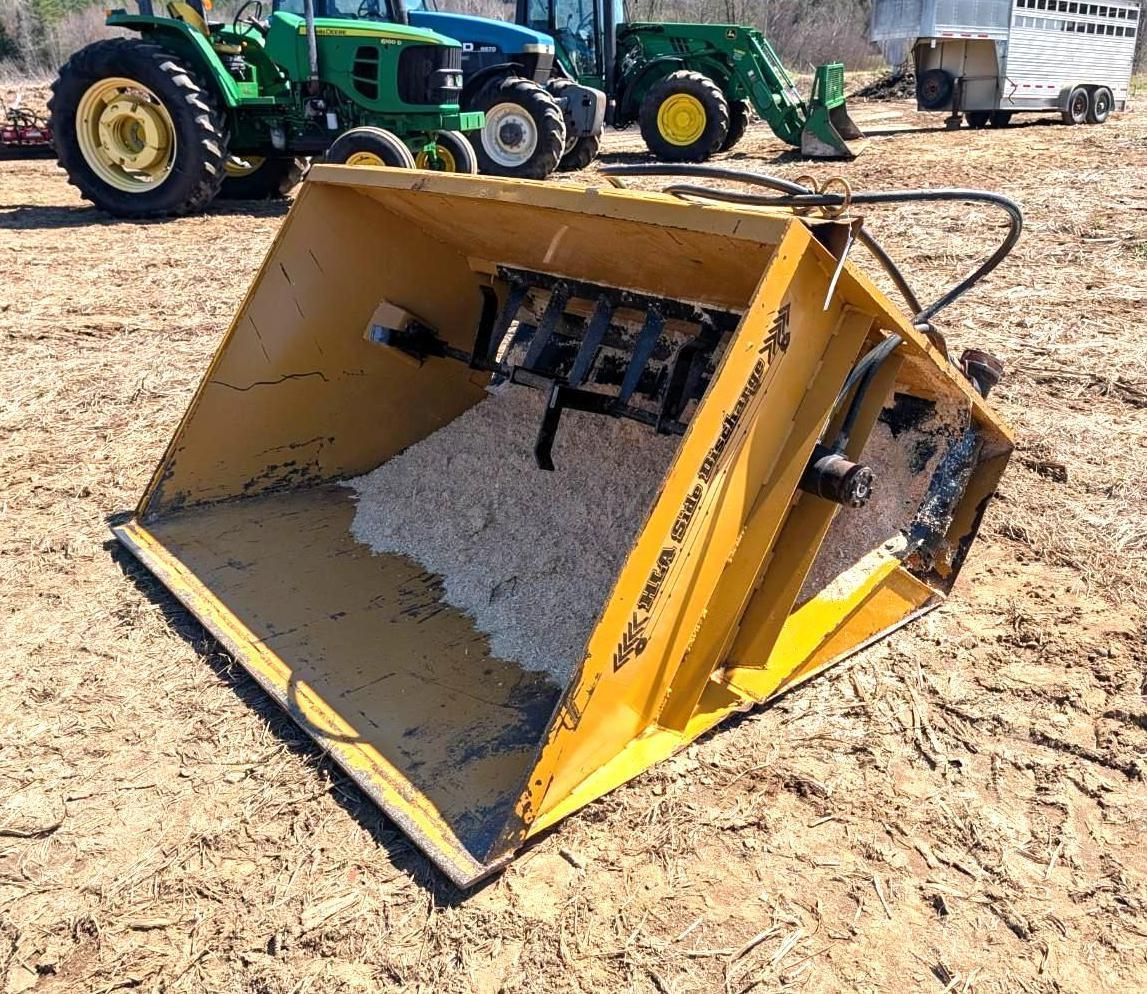 Yellow tractor bucket attachment.