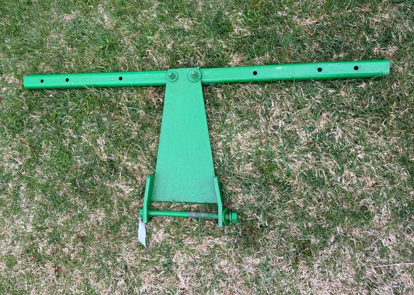 Green metal agricultural machinery part, viewed from above