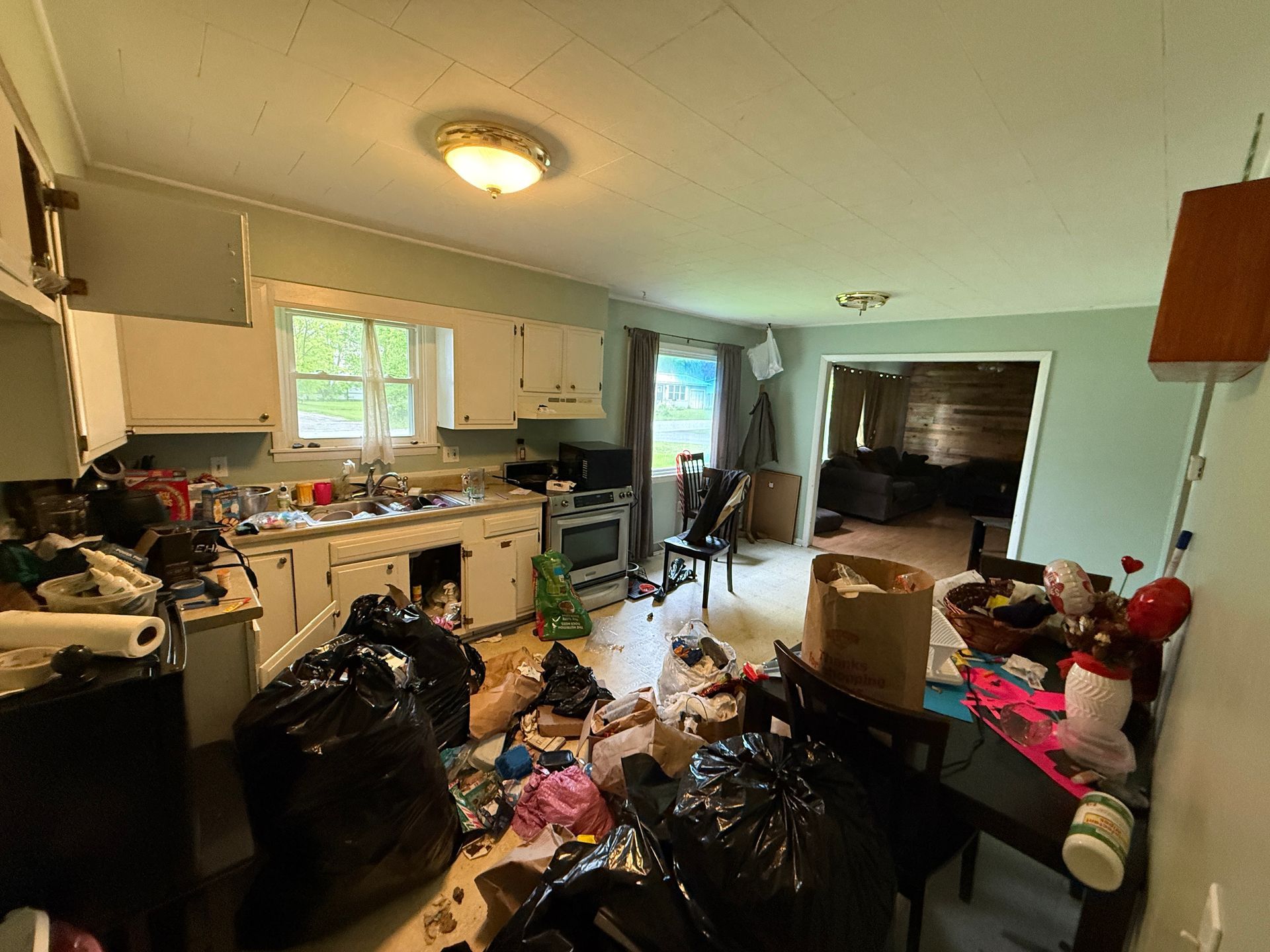 Kitchen with a doorway leads to another room.
