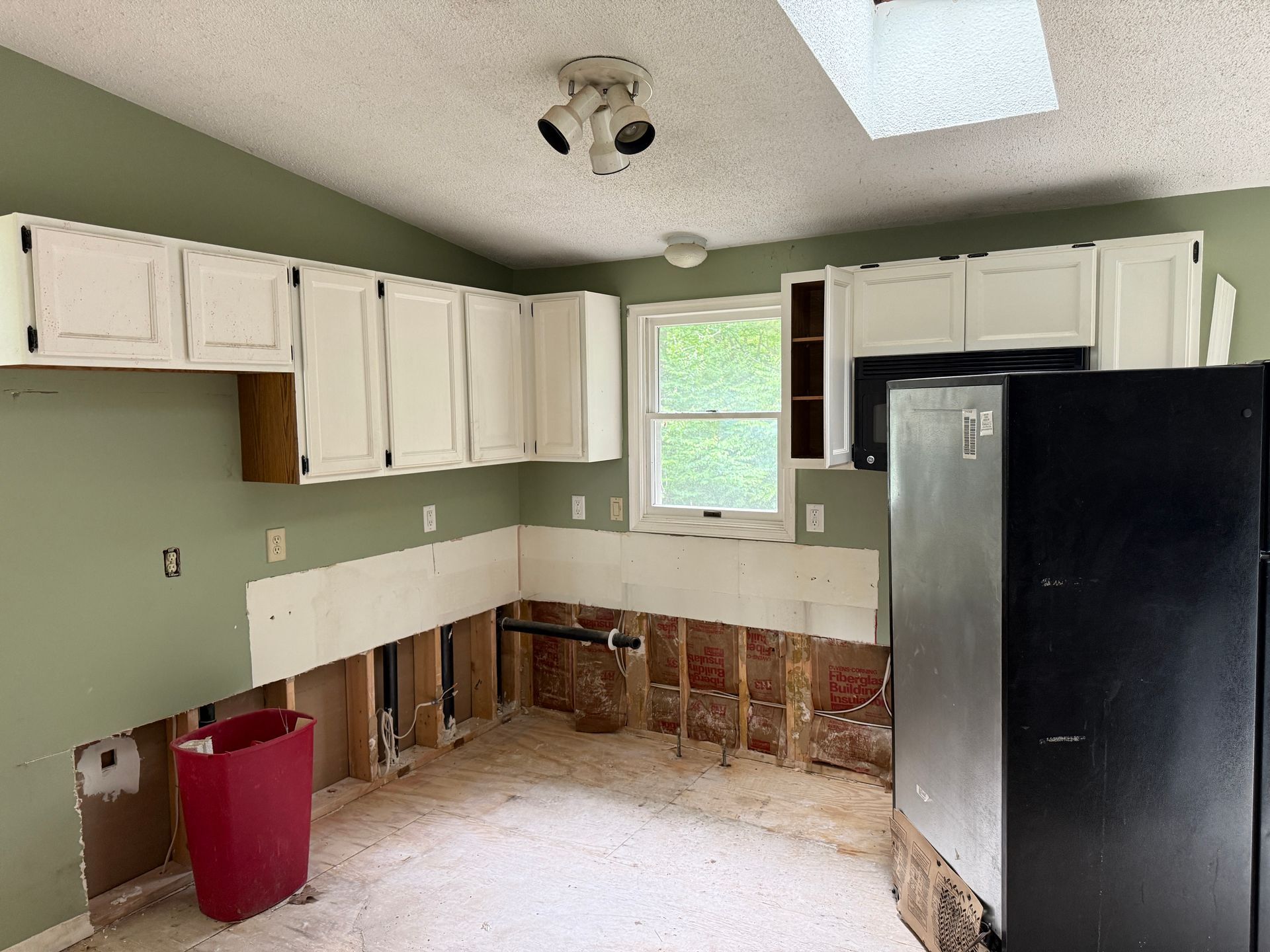 Kitchen with green walls.