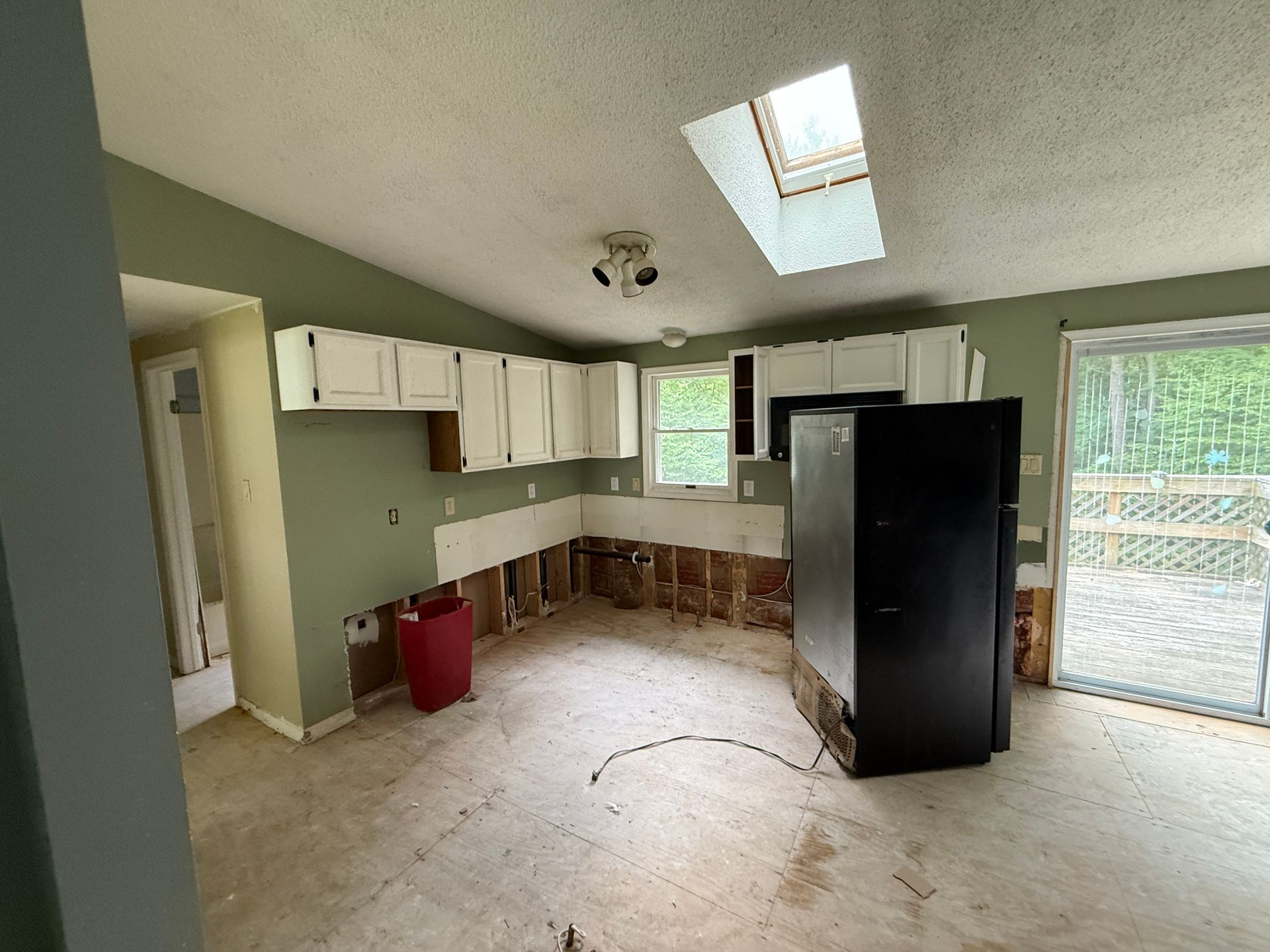 Kitchen with green walls.