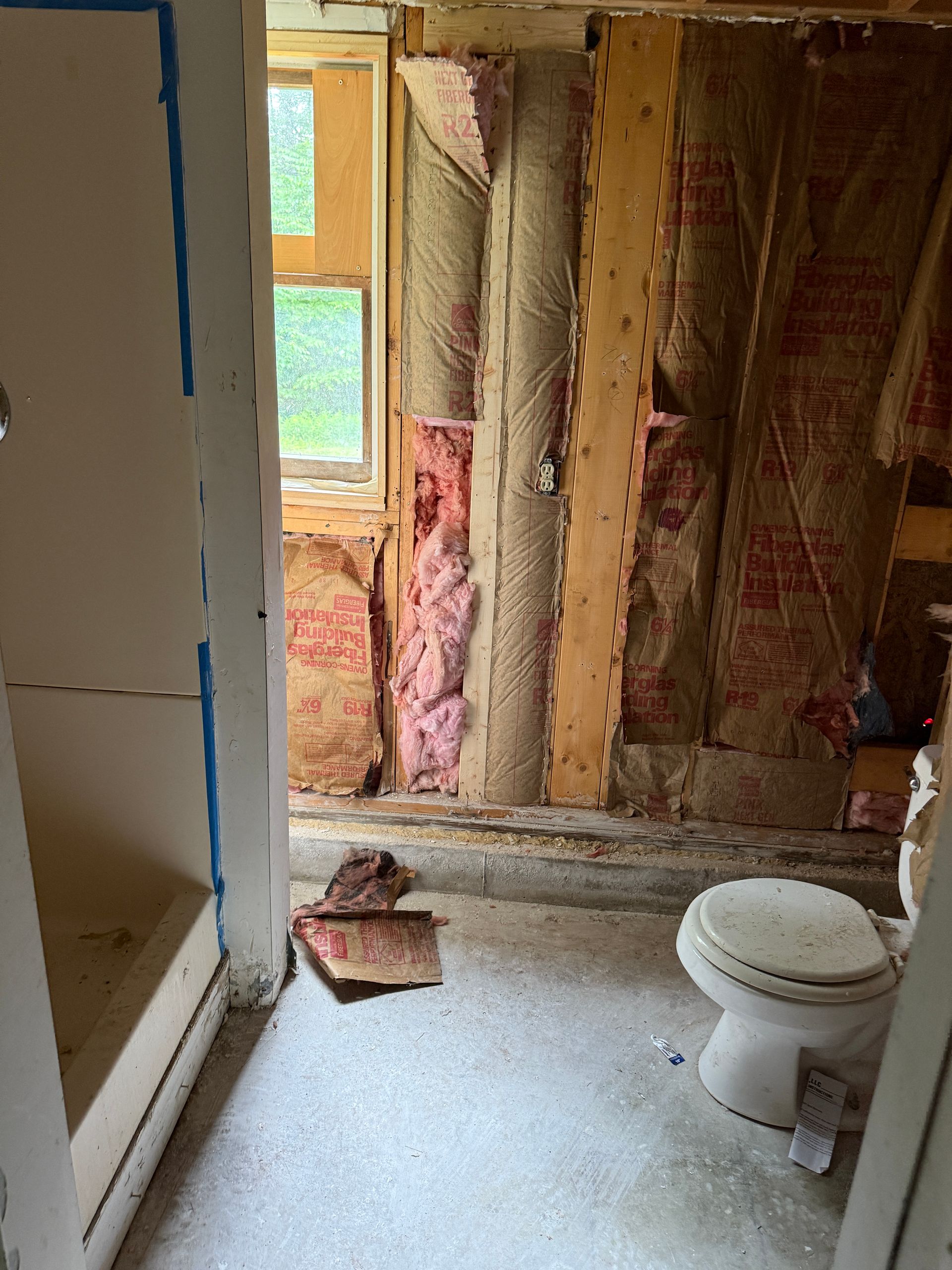 Bathroom, toilet and shower stall visible.