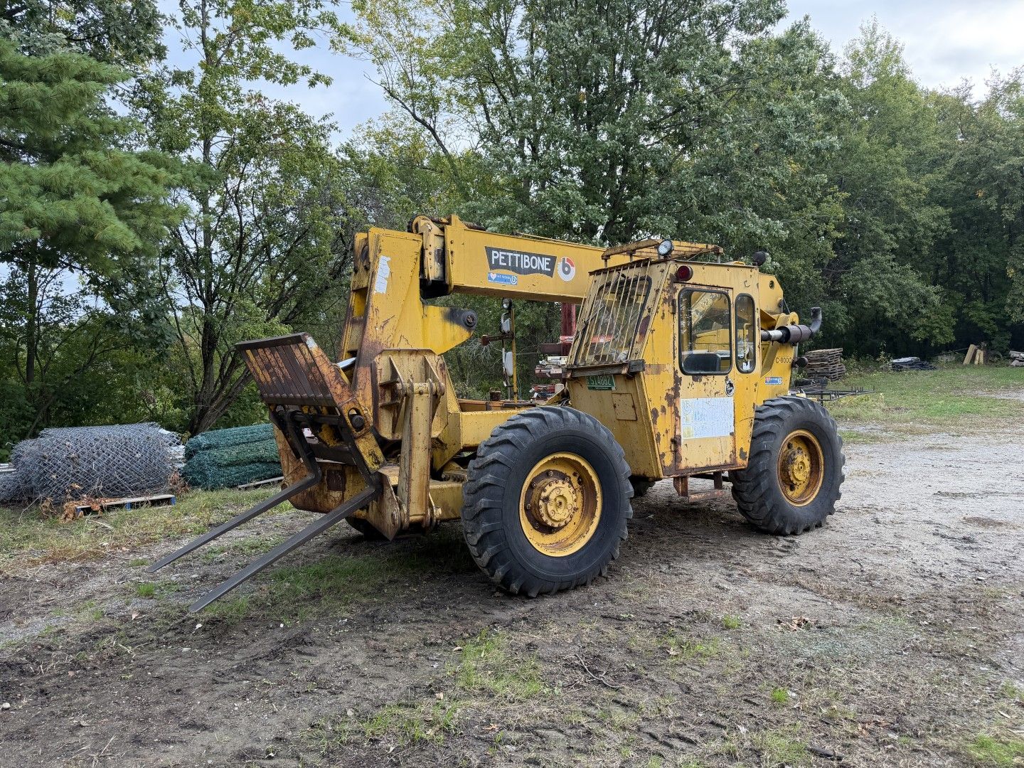 Yellow construction loader with forks