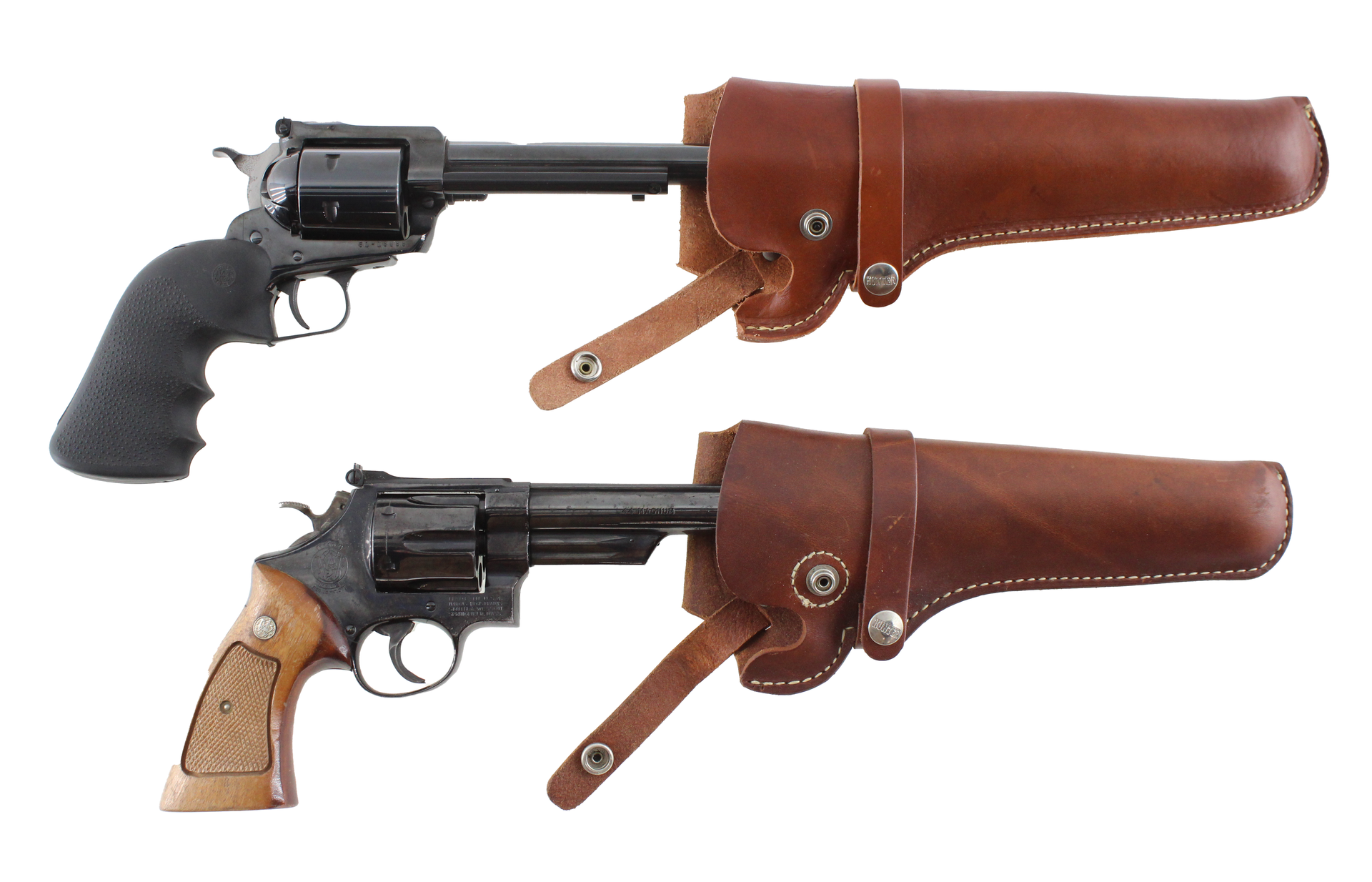 Two revolvers in brown leather holsters, one with a black grip, the other with a wooden grip.