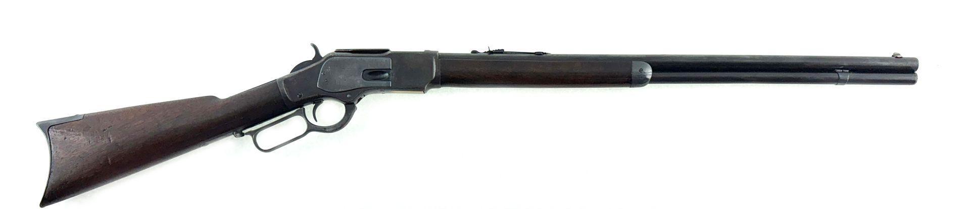 A lever-action rifle, likely a Winchester, set against a white backdrop.