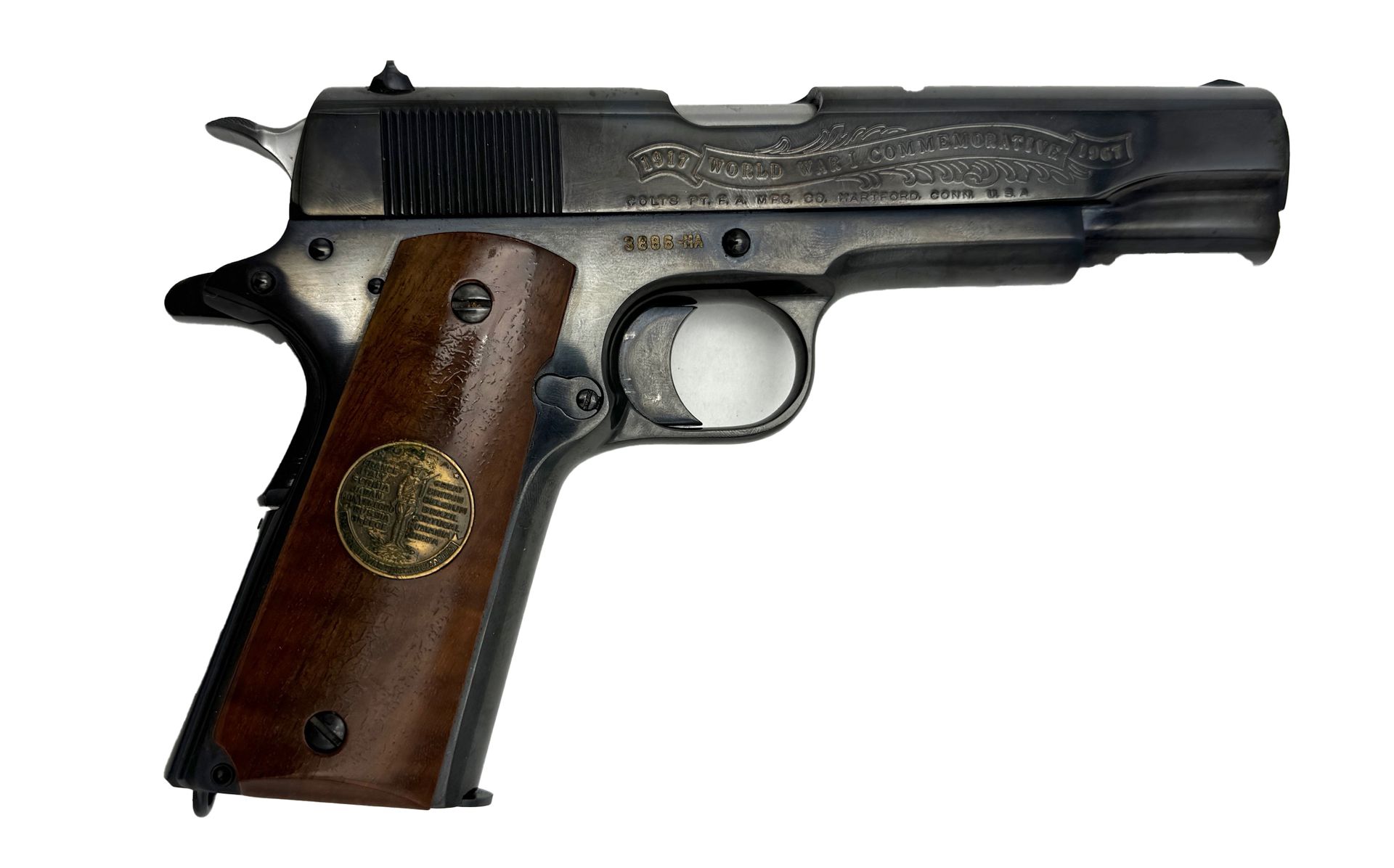 A dark gray, engraved handgun with a wooden grip.