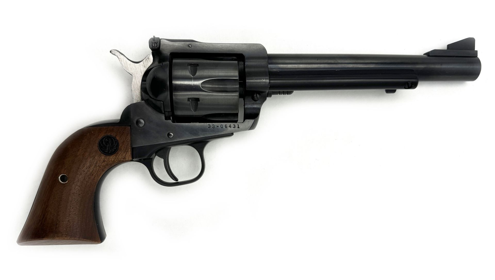 Black revolver handgun with wooden grip on white background.