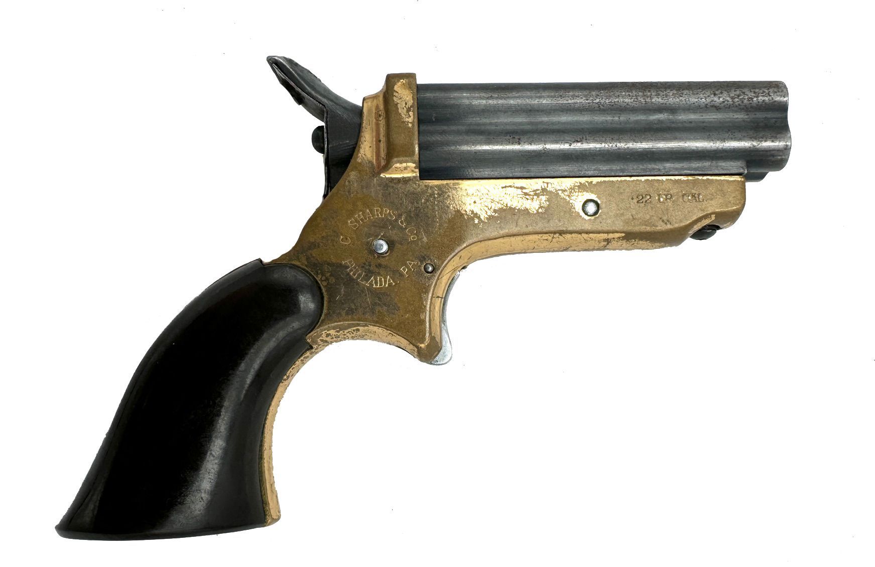 Antique brass and black pistol with four barrels, angled to the right.