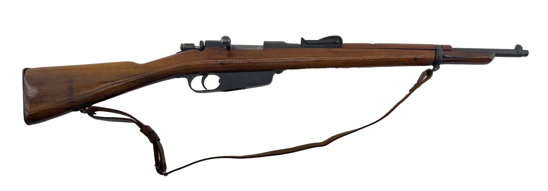 A brown Italian Carcano rifle with a sling, on a white background.