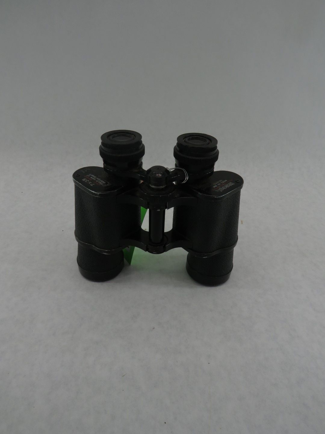 Black binoculars on a white background.