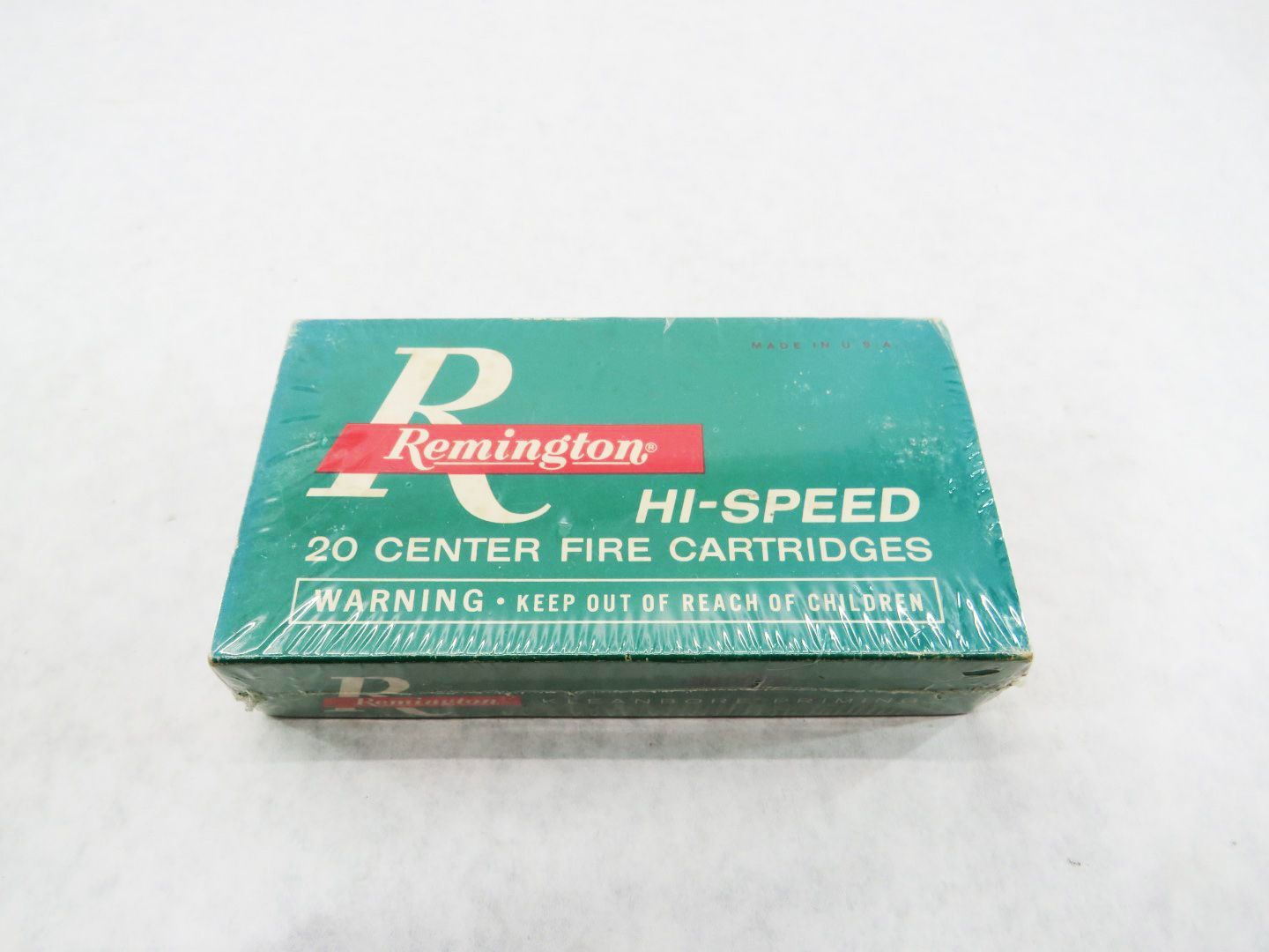 Box of Remington Hi-Speed 20 center fire cartridges, teal box with red lettering.