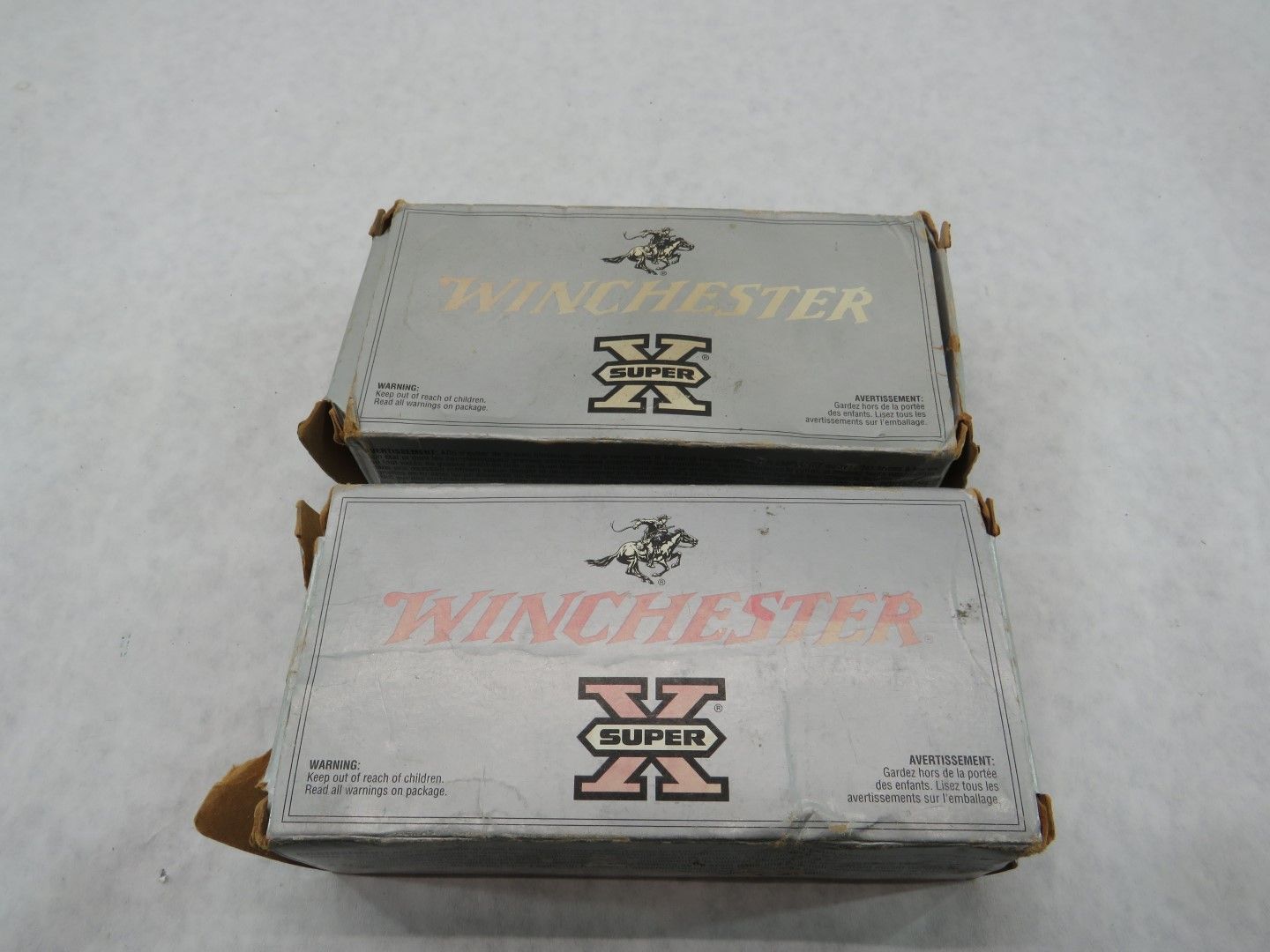 Two boxes of Winchester Super X ammunition stacked on top of each other.