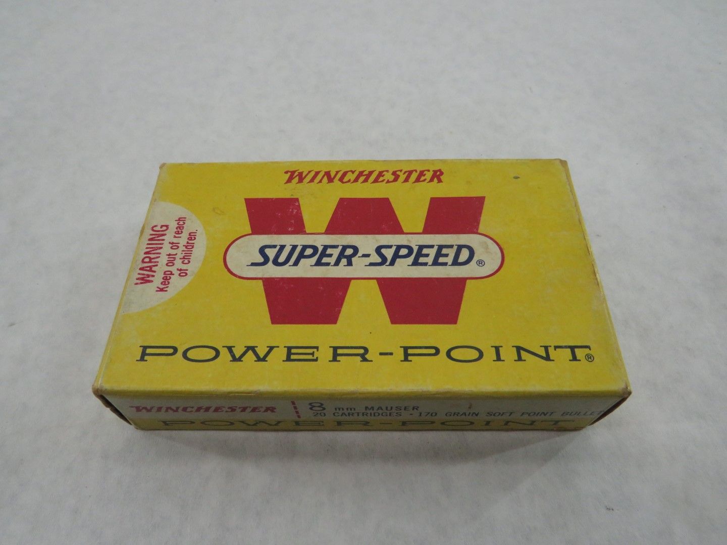 Yellow box of Winchester Super-Speed Power-Point ammunition with red logo and warning label.