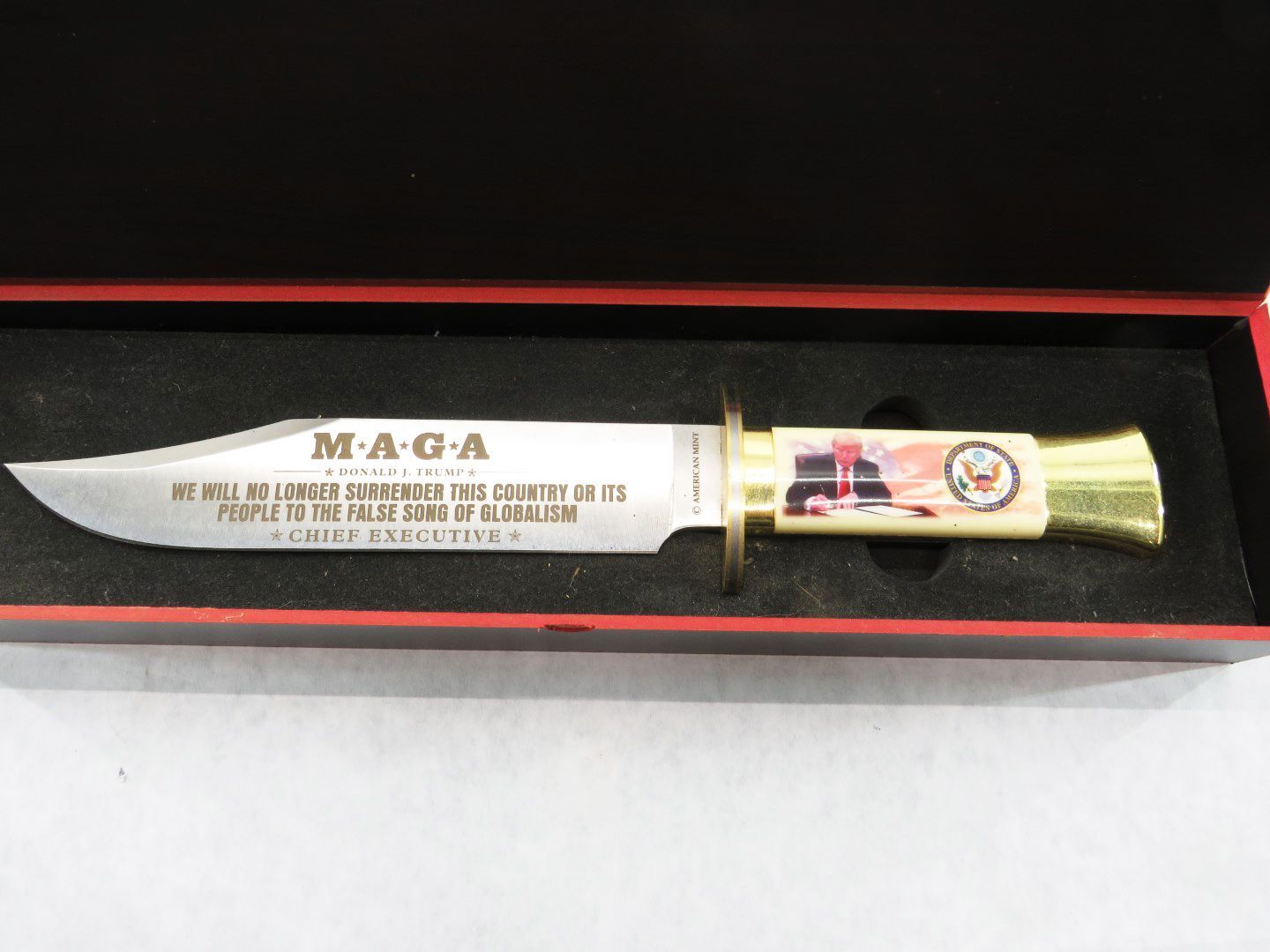Knife in a red-lined black box.